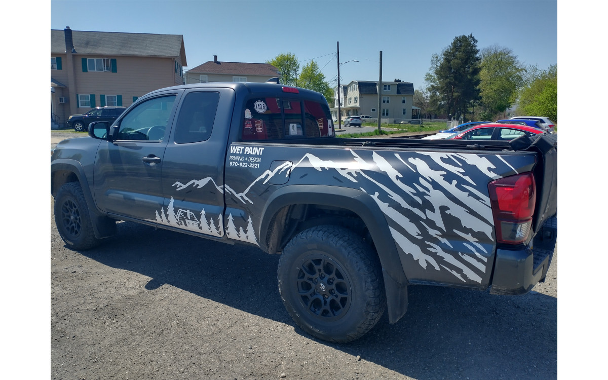 Introducing Our Newly Designed Vinyl Wrap: A Stunning Mountain Design on Our Work Truck